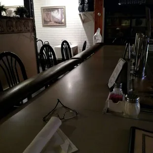 a table with a napkin and glasses on it