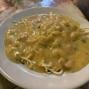 a plate of pasta and chicken