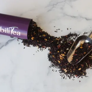 a cup of tea and a spoon