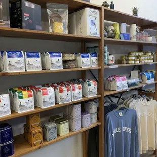 Lots of packaged coffee and tea for sale.