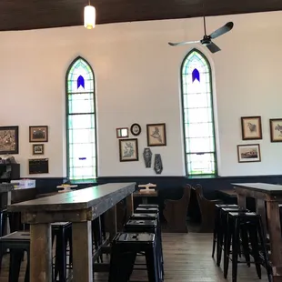 Located in a former church. Some seats are pews.
