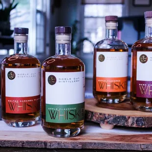 three different bottles of whisky