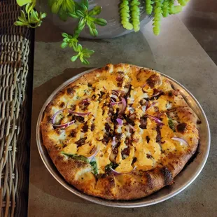 a pizza with onions and cheese