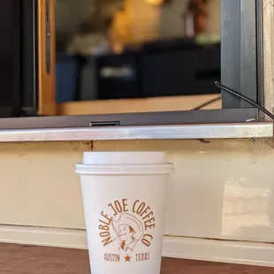 a cup of coffee on a counter