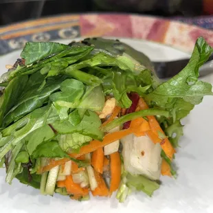 a plate with a salad on it