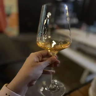 a woman holding a glass of wine