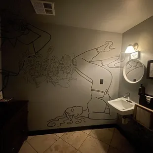 Intriguing art on bathroom wall