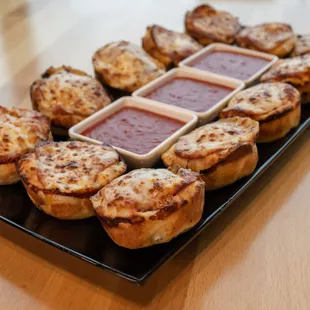 a platter of mini pizzas