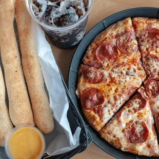 a pizza with pepperoni and cheese