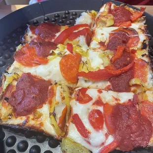 Medium deep dish with pepperoni, banana peppers, and roasted red peppers
