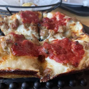 Individual size deep dish sausage pizza
