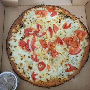 A "Pizza Margherita" - no fresh basil, but has onions (not requested)