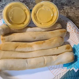 A few of the breadsticks from my family size order with excellent cheese dip.