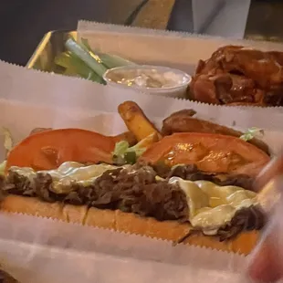 cheesesteak (buffalo wings in back)