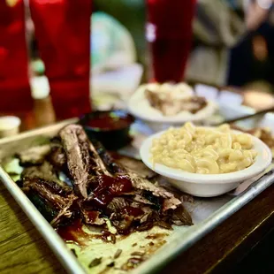 a tray of ribs and mashed potatoes