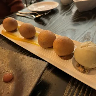 Chocolate Filled Donut Holes with passion fruit and pistachio gelato