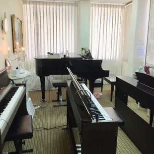 Our lesson room BOSTON baby grand piano &amp; 4 YAMAHA digital pianos