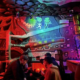 a group of people sitting around a table