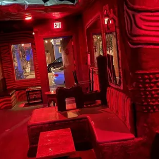 a man standing in a red room