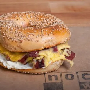 Pastrami and Egg Sandwich: Scrambled Egg, Aioli and Cheddar served on H&amp;H Bagel