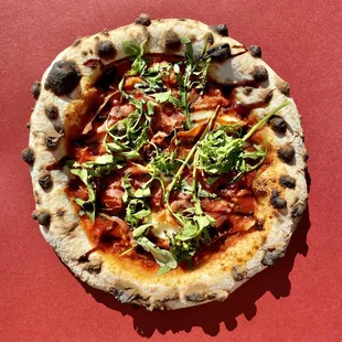  pizza on a red table