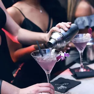 a bartender pouring a drink