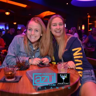 two women sitting at a table