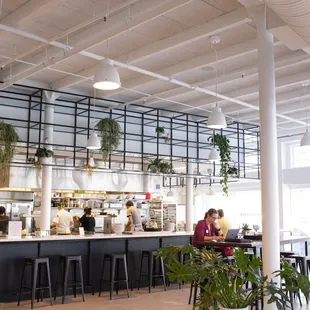 Seating includes communal tables, comfy armchairs and sofas, private tables, and countertop seating where you can interact with the chefs.