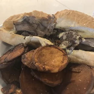 a plate of food with a sandwich and potato chips