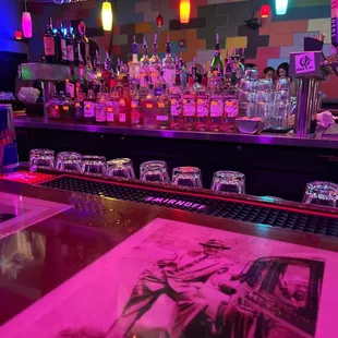 a bar filled with liquor bottles