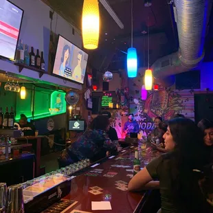 a woman sitting at a bar