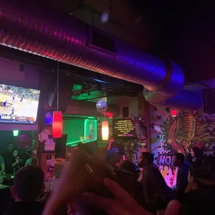 a crowd of people at a bar