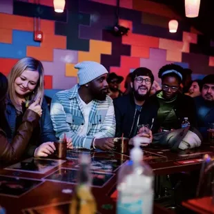 Friends having fun at karaoke bar