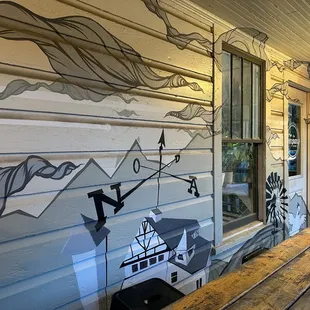 a porch with a painted mural