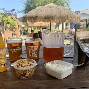 Orange cream soda, Pitcher of Costero Mexican Lager, garlic pita chips, spicy jalapeño dip, mixed nuts