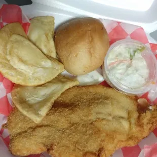 a chicken sandwich with coleslaw and a roll