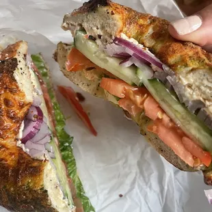 Pesto bagel w/ cream cheese - added lettuce, tomato, cucumber, &amp; onion