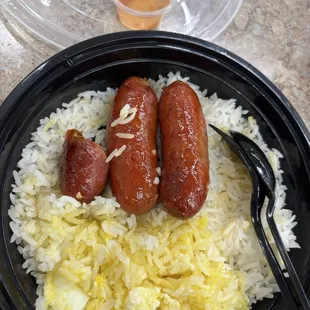 Longanisa breakfast with an over medium egg and vinegar sauce.  Delicious!