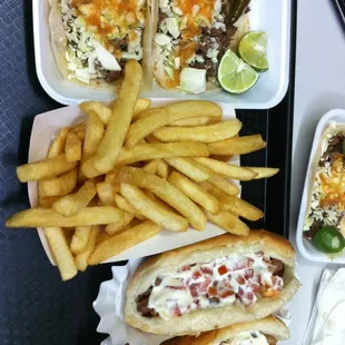 Tacos fries and hot dogs.