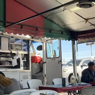 people eating at a food truck