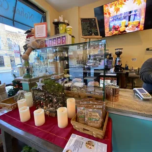 a counter with candles and cookies