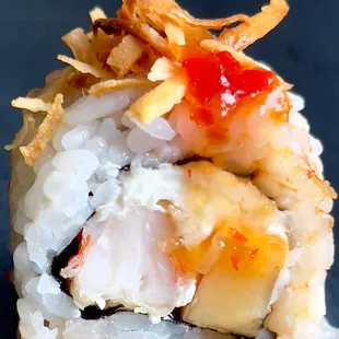 Pna Colada Mama
Tempura shrimp, pineapple and cream cheese  topped with sweet chili sauce and toasted coconut.