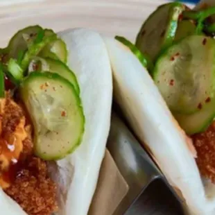 Chicken Katsu Bao Buns
Two steamed bao buns filled with sous vide, breaded, and crispy fried chicken katsu.