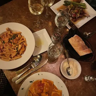 Pork chops in top right corner  Penne alla vodka left  Lobster ravioli on the right