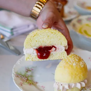 a person holding a piece of cake