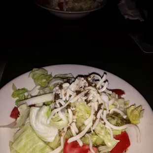 Side salads. Persian dressing on the near and Ranch on the far.  Extra large since they were out of rice.