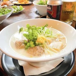 Shio Tori Paitan - Fluffy chicken tsukune meatballs, ginger, bamboo shoots, daikon sprouts, green onion, and Yuzu.