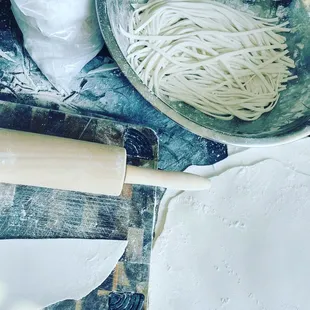 Handmade Lao udon with brown chicken soup