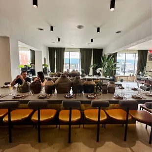 a large dining room with a long table and chairs