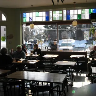 Nokomis Beach Coffee in the Winter with sunlight filtering through the skylight.
